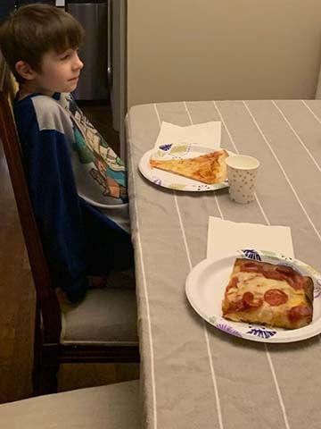 Boy at pizza party